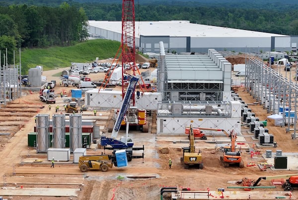 Aerial view of off-grid generators being installed, with the data center in the background, on Thursday, June 25, 2026, in Covington. A data center near Social Circle plans to get its primary power supply from a set of off-grid generators, the first setup of its kind in Georgia. But the company behind the power project is already installing its equipment, despite never obtaining proper permits from the state, a move environmental advocates say raises serious questions about oversight of data centers cropping up across Georgia. (Hyosub Shin/AJC)