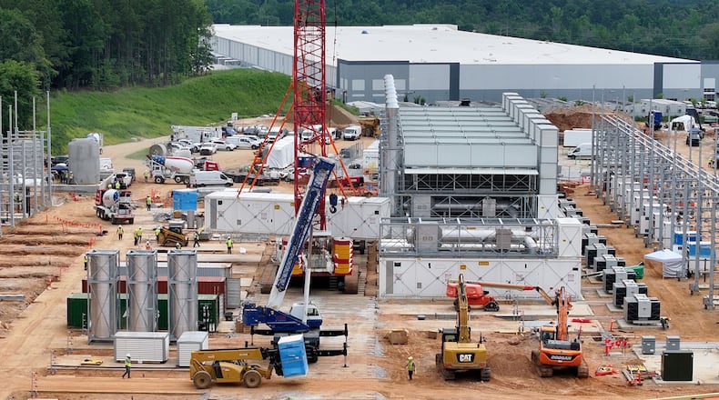 Aerial view of off-grid generators being installed, with the data center in the background, on Thursday, June 25, 2026, in Covington. A data center plans to get its primary power supply from a set of off-grid generators, the first setup of its kind in Georgia. (Hyosub Shin/AJC)
