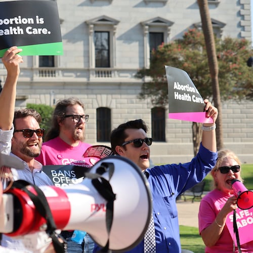 FILE - Over two dozen abortion rights supporters attend a rally outside the South Carolina State House in Columbia, S.C., on Aug. 23, 2023. (AP Photo/James Pollard, file)