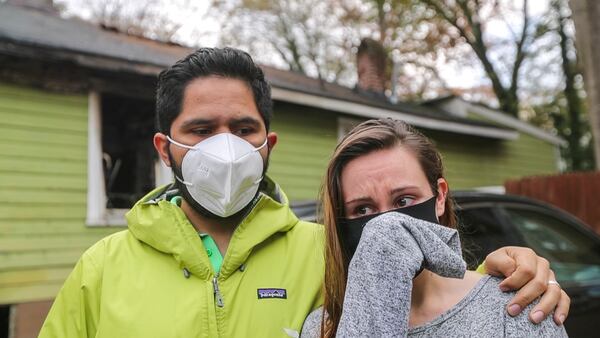 December 7, 2020 Atlanta: Antonio and Maureen Sanchez (shedding a tear) reflected on the life of their neighbor, Tyrone Sharpe on Monday, Dec. 7, 2020, He was a veteran well-known to his community that died Friday morning after he was pulled from a burning northwest Atlanta home, authorities said. Atlanta fire spokesman Sgt. Cortez Stafford said it is not known if Tyrone Sharpe died as a result of the fire, or if he was already unresponsive when the blaze broke out about 8:15 a.m. at a boarded-up home on the corner of Cairo Street and North Avenue. (John Spink / John.Spink@ajc.com)


