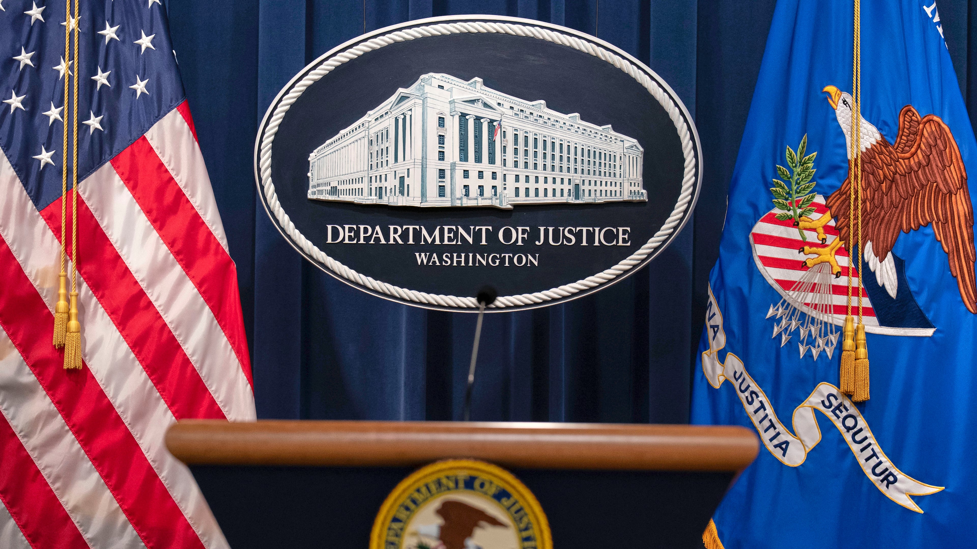 FILE - The Department of Justice seal and podium is viewed at the Department of Justice headquarters in Washington, April 16, 2025. (AP Photo/Jose Luis Magana, File)