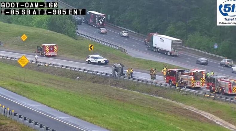 Several drivers who saw the burning van on I-85 in Gwinnett County tried to rescue the 16 passengers. Six people died in the crash.
