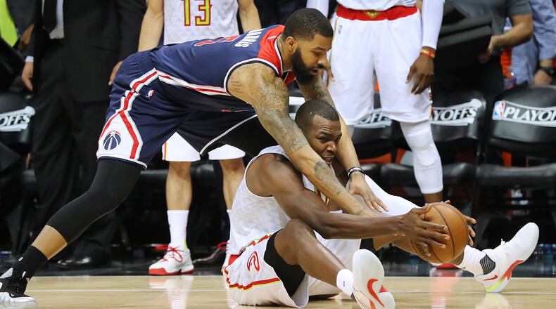 Atlanta Hawks’ Paul Millsap wins the battle for a lose ball with Washington Wizards’ Markieff Morris in Game 4 of a first-round NBA basketball playoff series on Monday, April 24, 2017, in Atlanta. Curtis Compton/ccompton@ajc.com