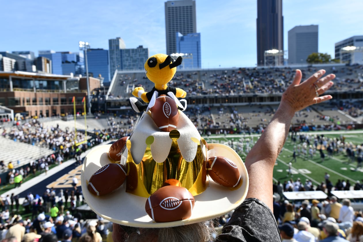 A Georgia Tech fan cheers before an NCAA college football game against Syracuse at Bobby Dodd Stadium, Saturday, Oct. 25, 2025 in Atlanta. (Hyosub Shin/AJC)