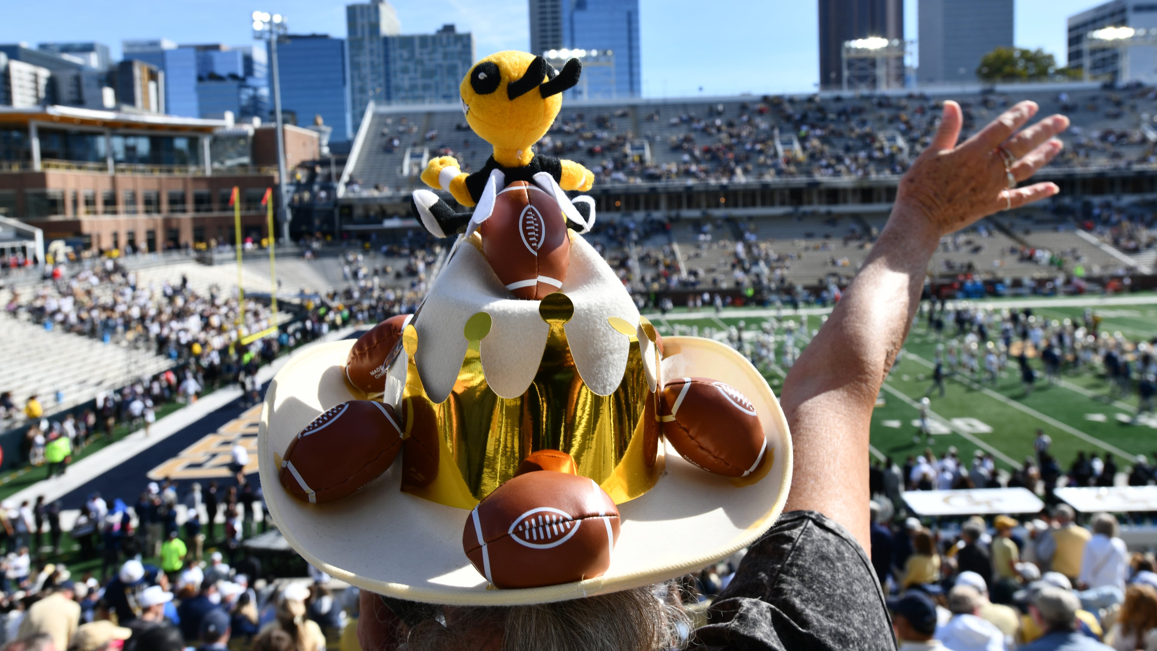 A Georgia Tech fan cheers before an NCAA college football game against Syracuse at Bobby Dodd Stadium, Saturday, Oct. 25, 2025 in Atlanta. (Hyosub Shin/AJC)