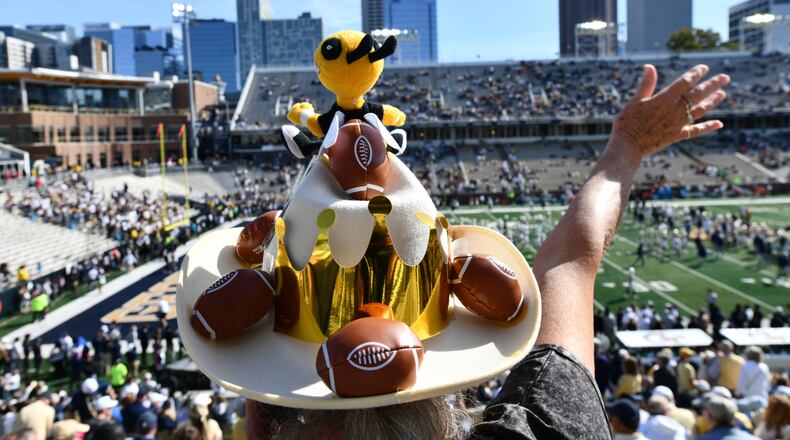 A Georgia Tech fan cheers before an NCAA college football game against Syracuse at Bobby Dodd Stadium, Saturday, Oct. 25, 2025 in Atlanta. (Hyosub Shin/AJC)
