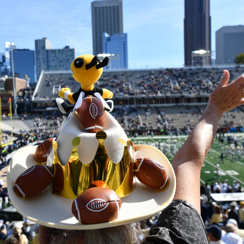 A Georgia Tech fan cheers before an NCAA college football game against Syracuse at Bobby Dodd Stadium, Saturday, Oct. 25, 2025 in Atlanta. (Hyosub Shin/AJC)