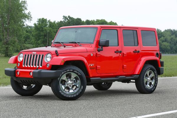 This photo provided by Jeep shows the 2016 Wrangler. A Wrangler has undeniable charm and is one of the few vehicles left that won't nickel-and-dime you with creature comforts you might not want. (Courtesy of Stellantis via AP)