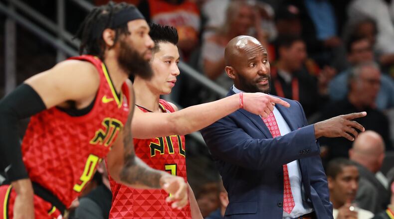 Atlanta Hawks head coach Lloyd Pierce coaches up Jeremy Lin against the Milwaukee Bucks during the second half in a NBA basketball game at State Farm Arena on Sunday, Jan. 13, 2019, in Atlanta.    Curtis Compton/ccompton@ajc.com