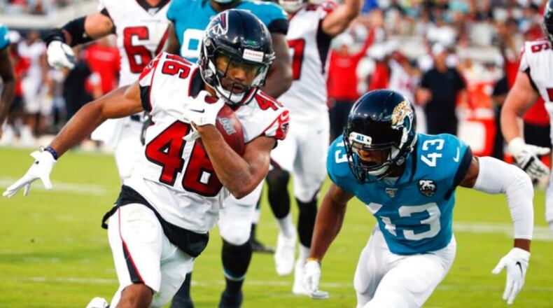 Atlanta Falcons running back Tony Brooks-James, left, runs past Jacksonville Jaguars defensive back Picasso Nelson (43) for a 15-yard touchdown run during the first half of an NFL preseason football game, Thursday, Aug. 29, 2019, in Jacksonville, Fla. (AP Photo/Stephen B. Morton)