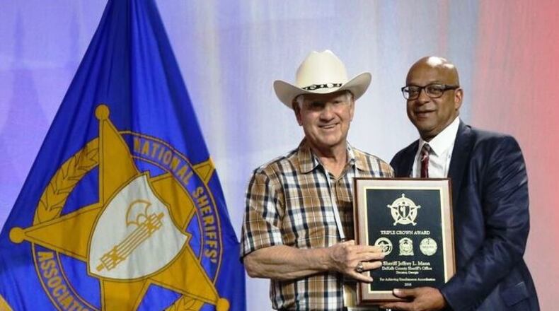 DeKalb County Sheriff Jeffrey Mann, right, accepts a second consecutive Triple Crown Award from National Sheriffs’ Association President Sheriff Harold Eavenson at the NSA Conference in New Orleans.