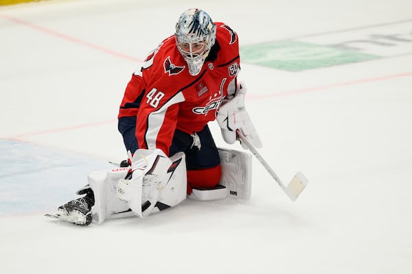 Washington Capitals goaltender Logan Thompson stops the puck in the third period of Game 2 of a first-round NHL hockey playoff series against the Montreal Canadiens Wednesday, April 23, 2025, in Washington. (AP Photo/Nick Wass)