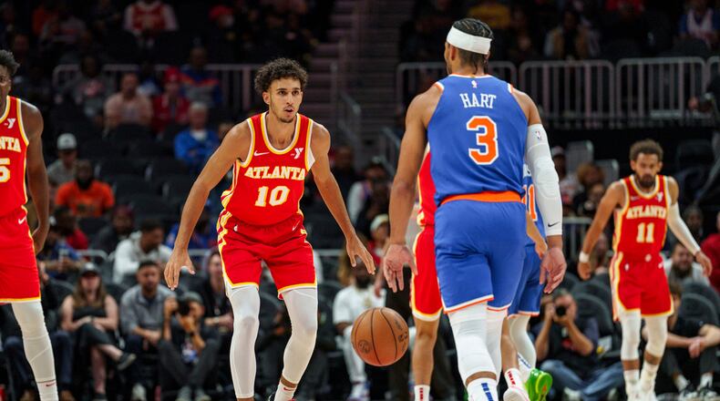 Atlanta Hawks forward Zaccharie Risacher (10) plays defense against New York Knicks guard Josh Hart (3) during the first half of an NBA basketball game, Wednesday, Nov. 6, 2024, in Atlanta. (AP Photo/Jason Allen)