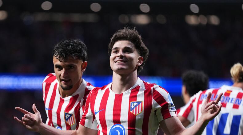 Atletico Madrid's Julian Alvarez, 2nd right, celebrates after scoring his sides first goal during a Champions League semifinal, first leg, soccer match between Atletico Madrid and Arsenal in Madrid, Spain, Wednesday, April 29, 2026. (AP Photo/Manu Fernandez)