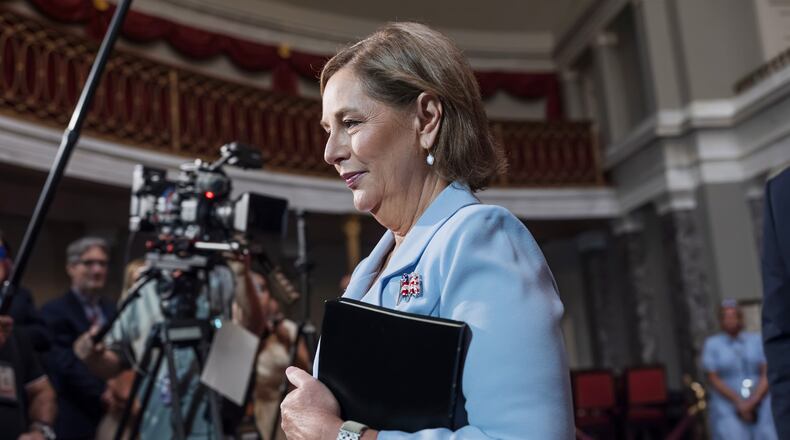 Newly-sworn Sen. Darline Graham, R-S.C., sister of Lindsey Graham, walks past cameras as she leaves the Old Senate Chamber following a cermonial oath of office ceremony allowing her to serve as her late brother's temporary replacement, at the Capitol in Washington, Tuesday, July 14, 2026, (AP Photo/J. Scott Applewhite)