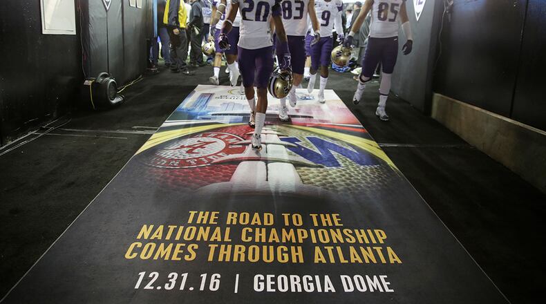 Washington players leave the field after warming up for the Peach Bowl NCAA college football playoff game against Alabama, Saturday, Dec. 31, 2016, in Atlanta. (AP Photo/David Goldman)