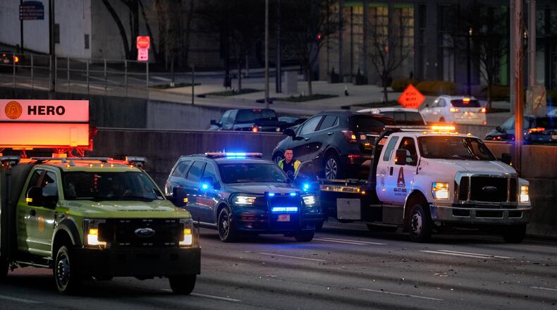 The Georgia Department of Transportation blocks traffic on the Downtown Connector after an early morning crash.