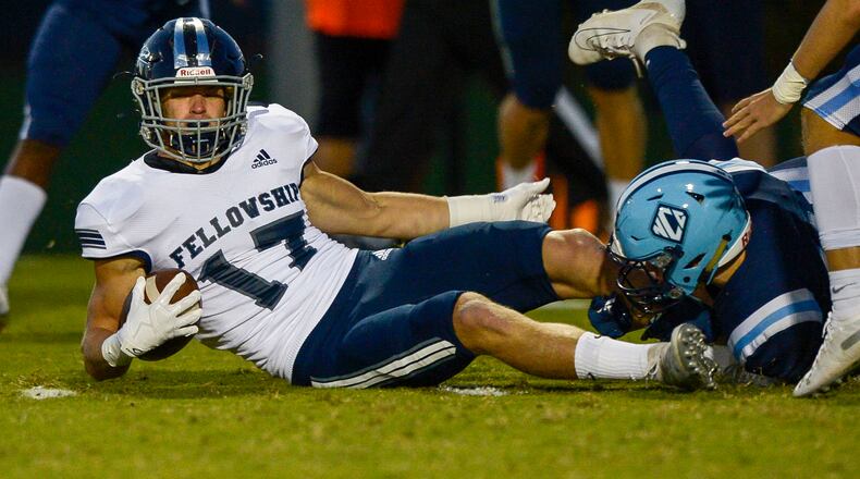 Fellowship Christian running back Murphy Reeves (17) is tackled during a running play in the first half of his regular-season game at North Cobb Christian.