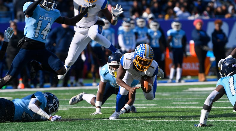 Crisp County QB AJ Lofton runs as Cedar Grove Safety Jordan Greer (9) brings him down during the AAA state title football game on Saturday Dec.14, 2019. John Amis / Special