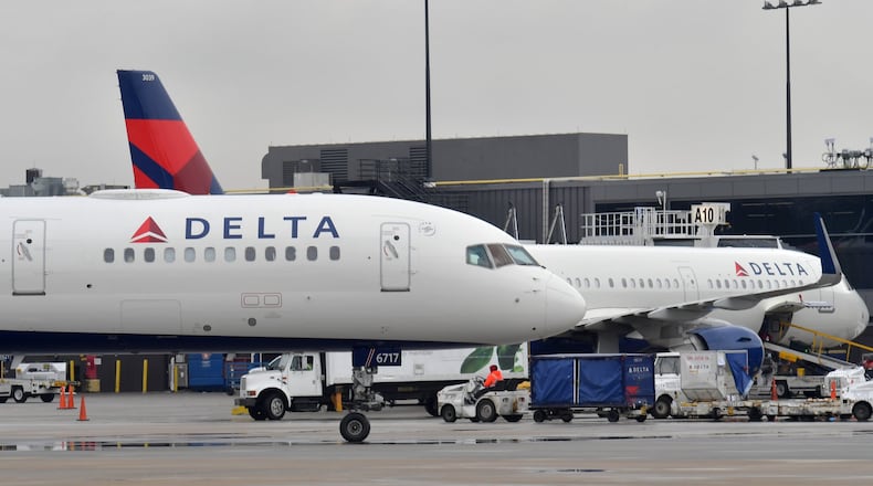 Delta planes at domestic gates at Hartsfield-Jackson International Airport. HYOSUB SHIN / HSHIN@AJC.COM