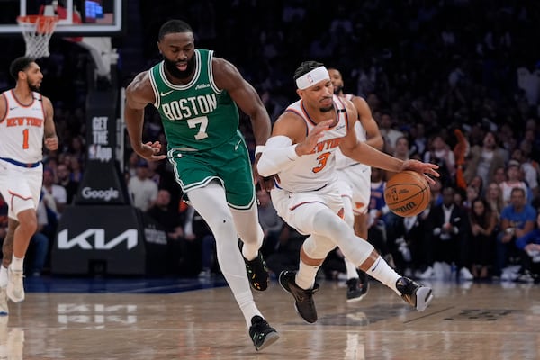 Boston Celtics' Jaylen Brown, left, knocks over New York Knicks' Josh Hart, right, during the first half of Game 3 of an NBA basketball second-round playoff series, Saturday, May 10, 2025, in New York. (AP Photo/Pamela Smith)