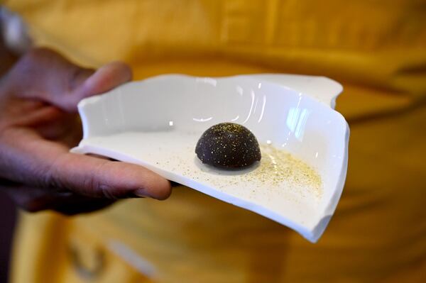 Bon Bon served on a broken dish at Heritage Supper Club on Friday, Sept. 4, 2026, in Atlanta. Heritage, chef Demetrius Brown’s highly anticipated new restaurant, is set to open Sept. (Hyosub Shin/AJC)