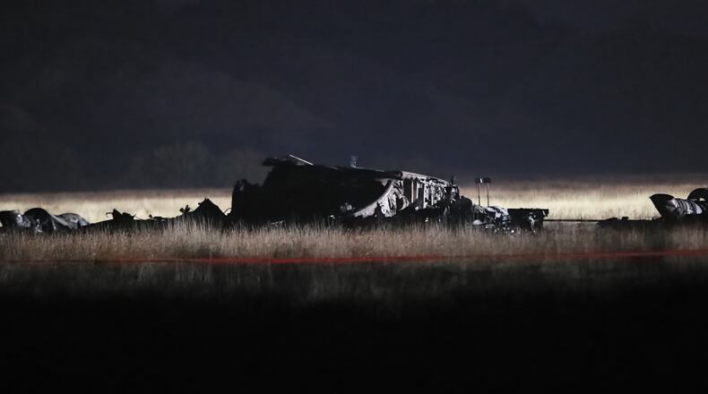 Debris is seen at a crash site of a Turkish military cargo plane in Georgia's Sighnaghi municipality, close to the Azerbaijani border on Wednesday, Nov. 12, 2025. (AP Photo/Zurab Tsertsvadze)