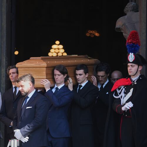 The casket of fashion designer Valentino Garavani leaves the St. Mary of Angels Basilica at the end of his funeral, in Rome, Friday, Jan. 23, 2026. (AP Photo/Andrew Medichini)