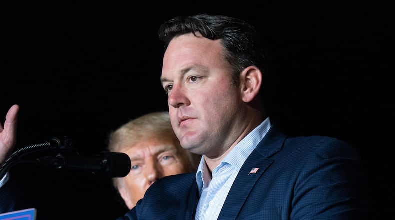 Georgia lieutenant gubernatorial candidate State Sen. Burt Jones (R-Georgia) speaks at a rally as former U.S. President Donald Trump watches on Sept. 25, 2021 in Perry, Georgia. (Sean Rayford/Getty Images/TNS)