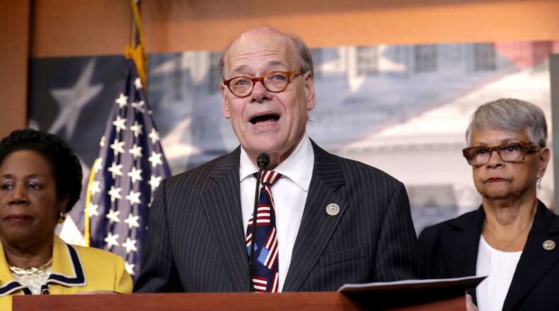 Rep. Steve Cohen (D-TN), center, said he would file articles of impeachment against President Donald Trump.