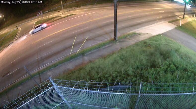 A man appears to enter a white car on Lakewood Avenue the night of a deadly shooting in southwest Atlanta.