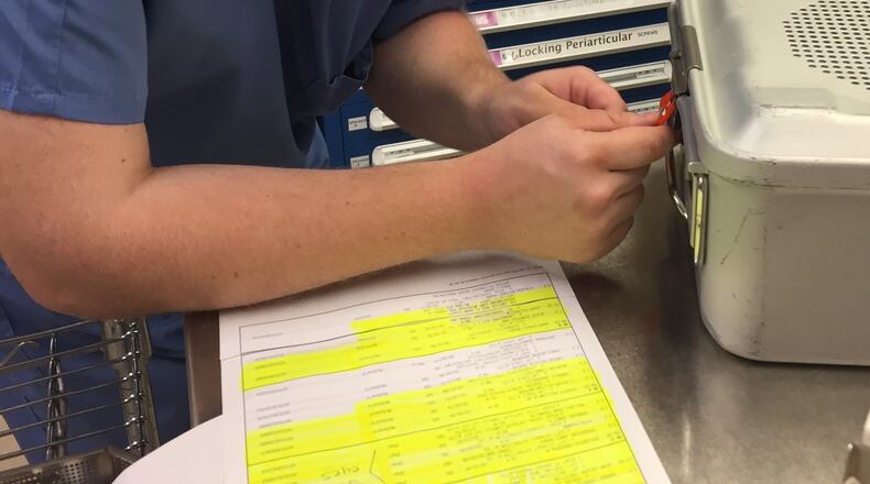 Bartow County student Mark Cole works at Cartersville Medical Center to label surgical instrument containers ready for sterilization. Cole is part of the school district’s Project Search program that provides internships and workplace preparedness experiences for special need students.