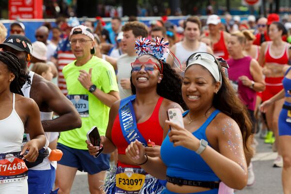 Many Peachtree racers embraced America's 250th birthday with patriotic outfits on Saturday. (Arvin Temkar/AJC)