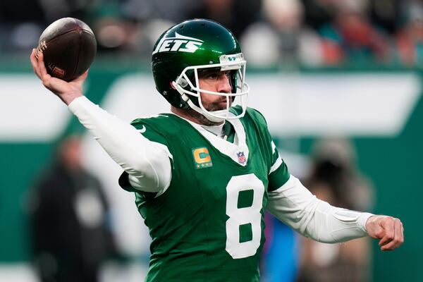 FILE - New York Jets quarterback Aaron Rodgers throws during the first half of an NFL football game against the Miami Dolphins, Sunday, Jan. 5, 2025, in East Rutherford, N.J. (AP Photo/Seth Wenig, File)