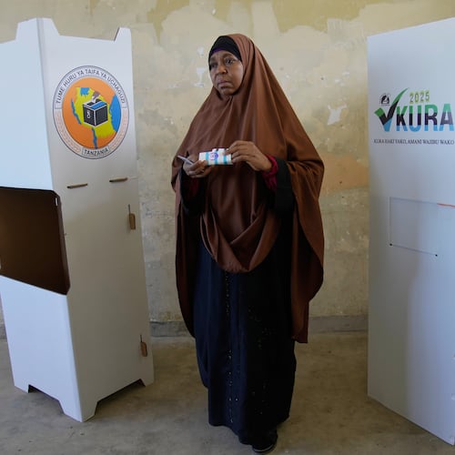 A woman casts her vote during the general elections at Mpendaye polling station in Zanzibar, Tanzania, Wednesday, Oct. 29, 2025. (AP Photo/Brian Inganga)