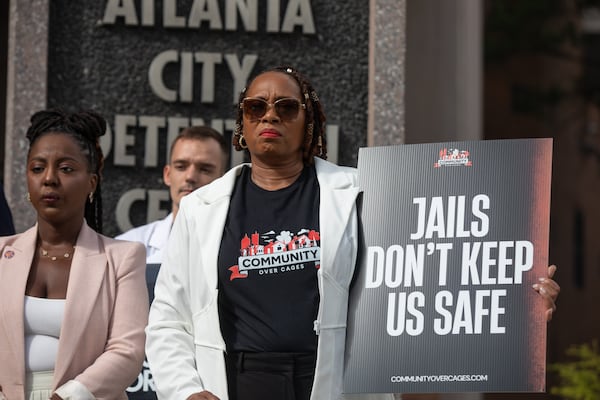 Activists, including Roberta Meyers (center) of the Legal Action Center, demonstrated on Aug. 13, 2025, calling for city officials to begin planning the withdrawal of Fulton County inmates from the Atlanta City Detention Center. (Riley Bunch/AJC)