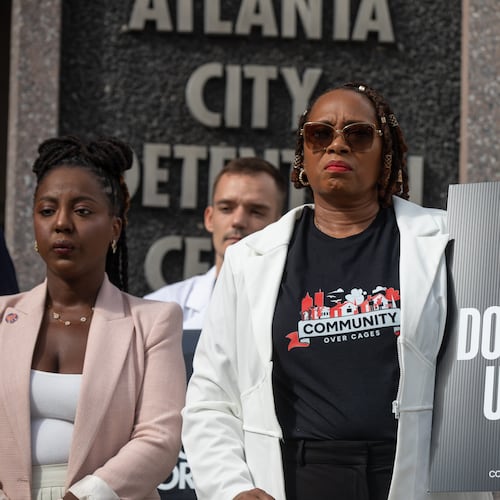 Roberta Meyers, with the Legal Action Center, joins advocates outside of the Atlanta City Detention Center on Aug. 13, 2025, to call for city officials to begin planning the withdrawal of Fulton County inmates from the jail. (Riley Bunch/AJC)
