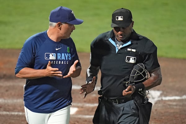 Tampa Bay Rays manager Kevin Cash argues with home plate umpire Alan Porter after Porter overruled another umpire on a strike out by Josh Lowe during the fifth inning of a baseball game against the Houston Astros Tuesday, May 20, 2025, in Tampa, Fla. (AP Photo/Chris O'Meara)