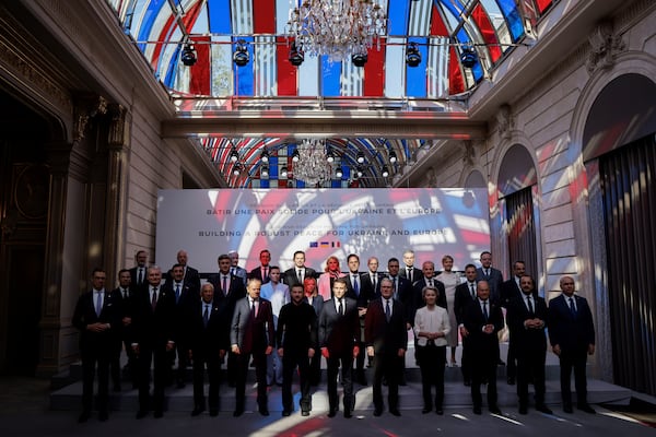 Officials pose as part of the so-called "Coalition of the willing" summit at the Elysee Palace, Thursday, March 27, 2025 in Paris. (Ludovic Marin, Pool via AP)