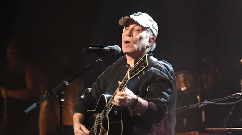 Singer Paul Simon performed four songs Saturday at a fundraiser near his Long Island home.