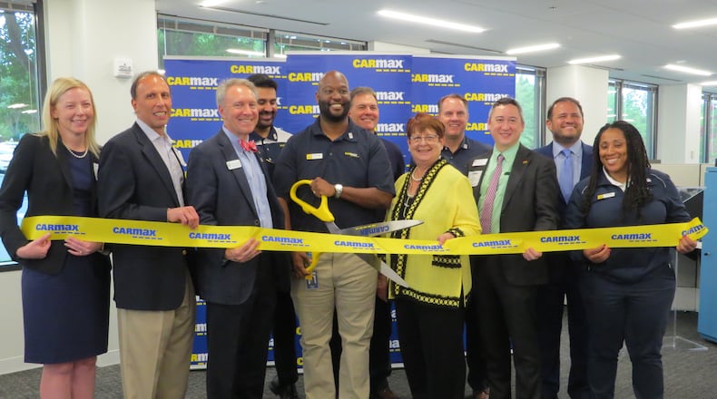 (Left to right) 2nd from left Peachtree Corners Councilmembers Phil Sadd and Weare Gratwick, 5th spot, Gwinnett County Board of Directors Chairman, Charlotte Nash, 6th position Commissioner Ben Ku, back right Nick Masino, Sr. VP of Economic Development & Partnership Gwinnett; joined by CarMax representatives. (Courtesy City of Peachtree Corners)