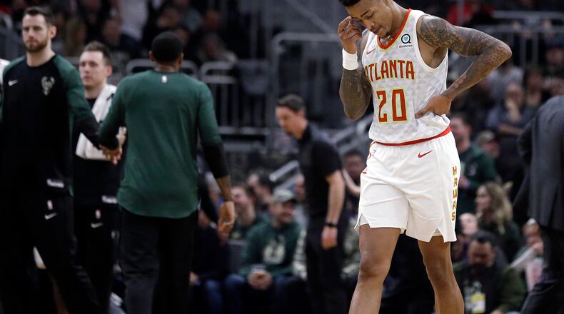 Hawks' John Collins walks to the bench during the game against the Milwaukee Bucks on Friday, Jan. 4, 2019, in Milwaukee. (AP Photo/Aaron Gash)