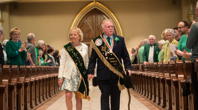St. Patrick's Day Parade Committee Grand Marshal George Schwarz III and his wife Patricia Hodges Schwarz enter the Cathedral Basilica of St. John the Baptist for St. Patrick's Day Mass. (Photo Courtesy of Will Peebles)