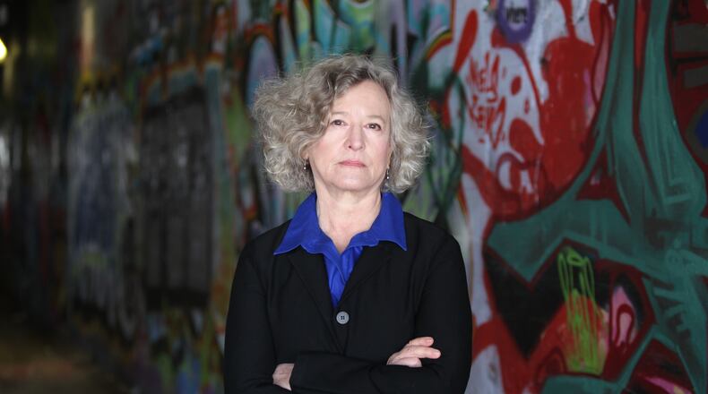 In this February 2016 photo, author Trudy Nan Boyce is seen in the Krog Street Tunnel. Boyce, a retired Atlanta Police Department officer, has written a second novel featuring an APD homicide detective as the lead character and the city as its setting. TAYLOR CARPENTER / TAYLOR.CARPENTER@AJC.COM