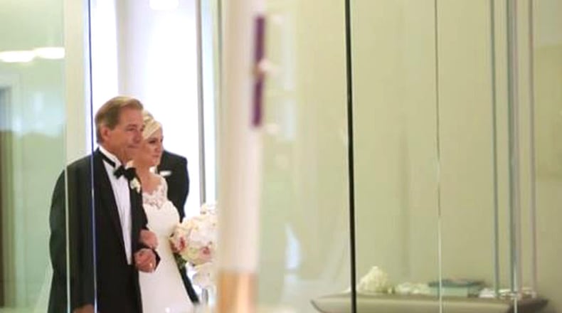 Nick Saban walks daughter, Kristen, down the aisle.
