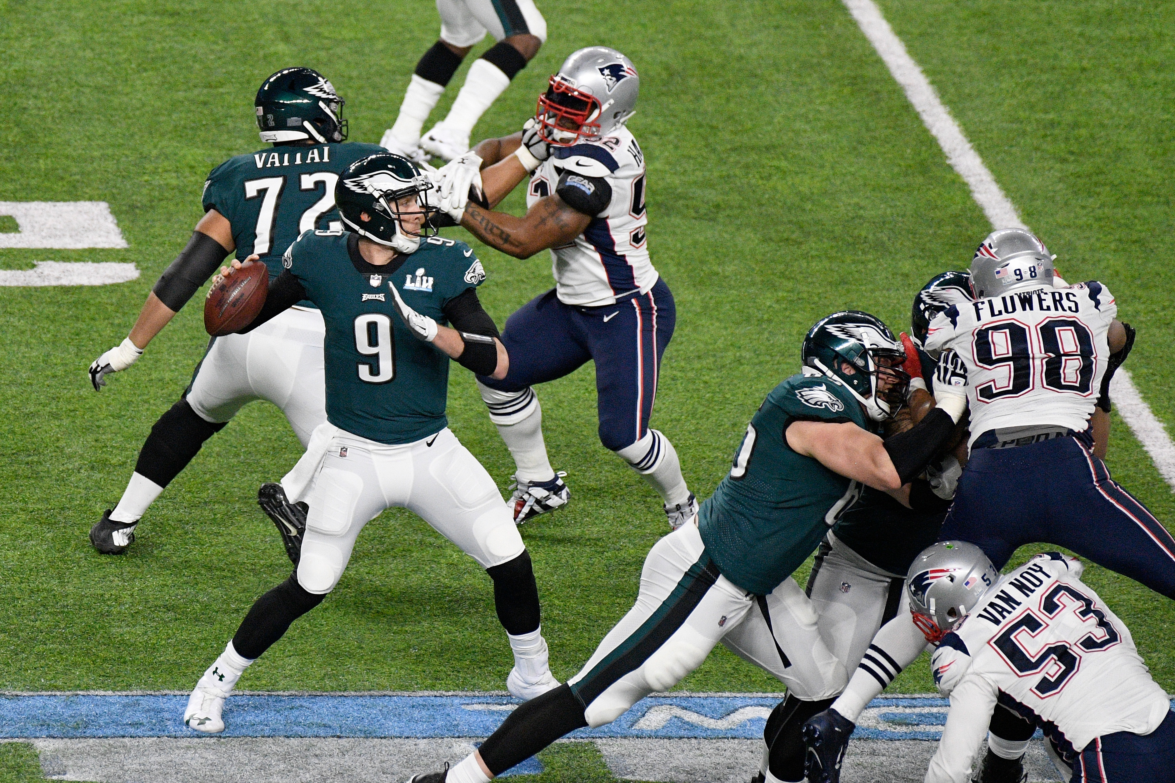 The Eagles’ Nick Foles  looks to pass against the  Patriots during the second quarter of Super Bowl LII at U.S. Bank Stadium.