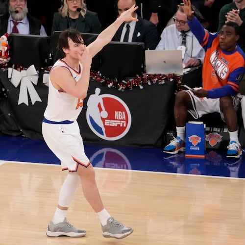 New York Knicks guard Tyler Kolek (13) reacts after scoring a three point goal during the second half of an NBA basketball game against the Cleveland Cavaliers, Thursday, Dec. 25, 2025, in New York. (AP Photo/Yuki Iwamura)