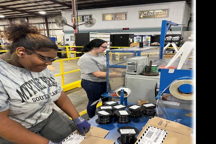 Two students in the Southwire 12 for Life program work on a project. 12 For Life was created by Southwire executives concerned about the then-high dropout rate at Carroll County High School and the impact it was having on the company's ability to hire employees. (Courtesy photo)