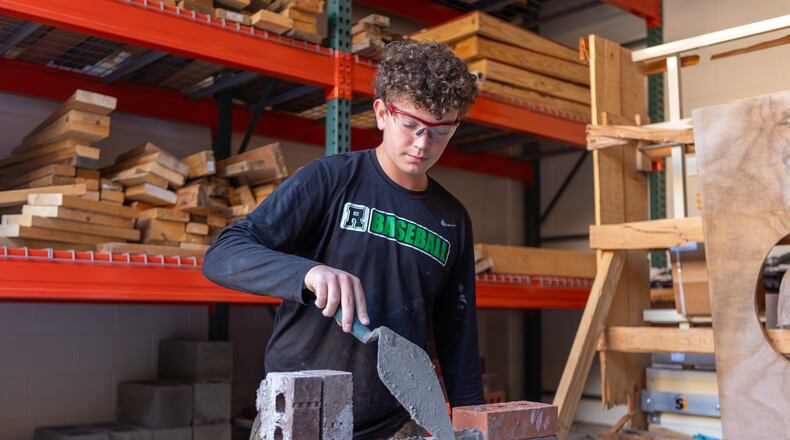 Students in Roswell High's construction classes have been working side by side with industry experts who have volunteered to teach the class.