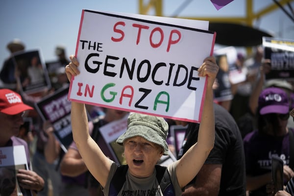 People take part in a protest demanding the end of the war in the Gaza Strip in an area near the Israeli-Gaza border in Sderot, southern Israel, Friday, May 23, 2025. (AP Photo/Leo Correa)